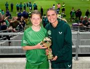 31 May 2023; Mairéad Mullins of Castleblakeney NS, Galway, is presented with the ‘A’ Girls Cup, for small sized schools, player of the tournament award by Republic of Ireland's Jamie Finn during the FAI Primary School 5s National Finals at the Aviva Stadium in Dublin. Photo by Stephen McCarthy/Sportsfile