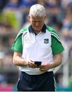 21 May 2023; LImerick manager John Kiely looks at his mobile phone before the Munster GAA Hurling Senior Championship Round 4 match between Tipperary and Limerick at FBD Semple Stadium in Thurles, Tipperary. Photo by Brendan Moran/Sportsfile