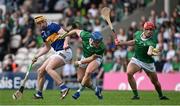21 May 2023; Barry Nash of Limerick, right, collects a loose sliotar ahead of teammate Michael Casey and Mark Kehoe of Tipperary during the Munster GAA Hurling Senior Championship Round 4 match between Tipperary and Limerick at FBD Semple Stadium in Thurles, Tipperary. Photo by Brendan Moran/Sportsfile