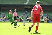 31 May 2023; Cayden Harty of St John the Apostle, Knocknacarra, Galway, has a shot on target during the ‘B’ Cup, for mixed medium sized schools, at the FAI Primary School 5s National Finals in the Aviva Stadium, Dublin. Photo by Eóin Noonan/Sportsfile