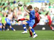 31 May 2023; Tiernan O’Flynn of Scoil Naomh Iosef, Dromcollogher, Limerick, in action against Noel Butler of St Joseph’s NS, Hacketstown, Carlow, during the ‘A’ Cup, for mixed small sized schools, at the FAI Primary School 5s National Finals in the Aviva Stadium, Dublin. Photo by Eóin Noonan/Sportsfile