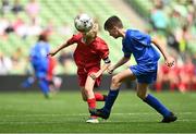 31 May 2023; Tiernan O’Flynn of Scoil Naomh Iosef, Dromcollogher, Limerick, in action against Oisín Wall of St Joseph’s NS, Hacketstown, Carlow, during the ‘A’ Cup, for mixed small sized schools, at the FAI Primary School 5s National Finals in the Aviva Stadium, Dublin. Photo by Eóin Noonan/Sportsfile