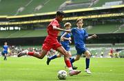 31 May 2023; Evan Lonergan of Ballylooby NS, Tipperary, in action against Daniel Trainor of St Colman’s NS, Mucklagh, Offaly, during the ‘B’ Cup, for mixed medium sized schools, at the FAI Primary School 5s National Finals in the Aviva Stadium, Dublin. Photo by Eóin Noonan/Sportsfile