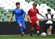 31 May 2023; Stephen Moran of St Kevin’s NS, Greystones, Wicklow, in action against Louis Fitzgerald of Monaleen NS, Limerick, during the ‘C’ Cup, for mixed large sized schools, at the FAI Primary School 5s National Finals in the Aviva Stadium, Dublin. Photo by Eóin Noonan/Sportsfile