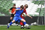 31 May 2023; Dylan Corbett of St Kevin’s NS, Greystones, Wicklow, in action against Louis Fitzgerald of Monaleen NS, Limerick, during the ‘C’ Cup, for mixed large sized schools, at the FAI Primary School 5s National Finals in the Aviva Stadium, Dublin. Photo by Eóin Noonan/Sportsfile