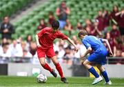 31 May 2023; Mohammed Mukbel of Monaleen NS, Limerick, in action against Cillian Walsh of St Kevin’s NS, Greystones, Wicklow, during the ‘C’ Cup, for mixed large sized schools, at the FAI Primary School 5s National Finals in the Aviva Stadium, Dublin. Photo by Eóin Noonan/Sportsfile