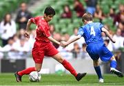 31 May 2023; Mohammed Mukbel of Monaleen NS, Limerick, in action against Cillian Walsh of St Kevin’s NS, Greystones, Wicklow, during the ‘C’ Cup, for mixed large sized schools, at the FAI Primary School 5s National Finals in the Aviva Stadium, Dublin. Photo by Eóin Noonan/Sportsfile