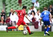 31 May 2023; Mohammed Mukbel of Monaleen NS, Limerick, in action against Cillian Walsh of St Kevin’s NS, Greystones, Wicklow, during the ‘C’ Cup, for mixed large sized schools, at the FAI Primary School 5s National Finals in the Aviva Stadium, Dublin. Photo by Eóin Noonan/Sportsfile