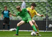 31 May 2023; Jack Nolan of St Mary’s NS, Mountbellew, Galway, in action against Ethan McLoughlin of Scoil Naomh Colmcille, Donegal, during the ‘A’ Cup, for mixed small sized schools, at the FAI Primary School 5s National Finals in the Aviva Stadium, Dublin. Photo by Eóin Noonan/Sportsfile