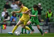 31 May 2023; Kayden McCloskey of Scoil Naomh Colmcille, Donegal, in action against Cuan Kelly of St Mary’s NS, Mountbellew, Galway, during the ‘A’ Cup, for mixed small sized schools, at the FAI Primary School 5s National Finals in the Aviva Stadium, Dublin. Photo by Eóin Noonan/Sportsfile