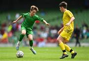 31 May 2023; Cayden Harty of St John the Apostle, Knocknacarra, Galway in action against Ben Farrell of St Eunan’s NS, Raphoe, Donegal, during the ‘B’ Cup, for mixed medium sized schools, at the FAI Primary School 5s National Finals in the Aviva Stadium, Dublin. Photo by Eóin Noonan/Sportsfile