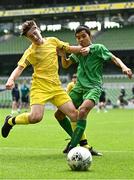 31 May 2023; Odhran McHugh of St Eunan’s NS, Raphoe, Donegal, in action against John Mark Browne of St John the Apostle, Knocknacarra, Galway during the ‘B’ Cup, for mixed medium sized schools, at the FAI Primary School 5s National Finals in the Aviva Stadium, Dublin. Photo by Eóin Noonan/Sportsfile