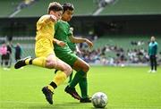 31 May 2023; Odhran McHugh of St Eunan’s NS, Raphoe, Donegal, in action against John Mark Browne of St John the Apostle, Knocknacarra, Galway during the ‘B’ Cup, for mixed medium sized schools, at the FAI Primary School 5s National Finals in the Aviva Stadium, Dublin. Photo by Eóin Noonan/Sportsfile