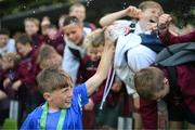 31 May 2023; Jake Somers of St Kevin’s NS, Greystones, Wicklow, celebrates with supporters after his side won the ‘C’ Cup, for mixed large sized schools, at the FAI Primary School 5s National Finals in the Aviva Stadium, Dublin. Photo by Stephen McCarthy/Sportsfile