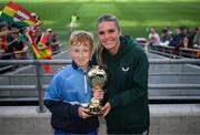 31 May 2023; Páidí Connolly of St Joseph’s NS, Hacketstown, Carlow, is presented with the ‘A’ Cup, for mixed small sized schools, player of the tournament award by Republic of Ireland's Jamie Finn at the FAI Primary School 5s National Finals in the Aviva Stadium, Dublin. Photo by Stephen McCarthy/Sportsfile