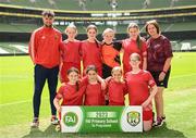 31 May 2023; Kilbehenny NS, Limerick, back row, from left, Mark O’Connell, Saoirse Clifford, Ciara Maher, Lucy Bailey, Meabh Kearney and Olive Kenneally, with, front row, Lucy Geary, Aoife Noonan, Aoife Casey and Róisín Dooley before the ‘A’ Girls Cup, for small sized schools, at the FAI Primary School 5s National Finals in the Aviva Stadium, Dublin. Photo by Stephen McCarthy/Sportsfile