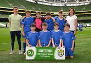 31 May 2023; St Colman’s NS, Mucklagh, Offaly, back row, Keith O’Connor, Keith O’Rourke, Oisín Rigney, Conor McEvoy, Tim Cusack and Claire McIntyre, with, front row, David O’Shea, Jayden Daly, Daniel Trainor and Ben Nestor before the ‘B’ Cup, for mixed medium sized schools, at the FAI Primary School 5s National Finals in the Aviva Stadium, Dublin. Photo by Stephen McCarthy/Sportsfile
