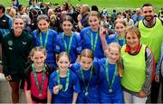 31 May 2023; Republic of Ireland's Jamie Finn with Scoil Naomh Peadar S’Pol, Ballon, Carlow after the ‘B’ Girls Cup, for medium sized schools, at the FAI Primary School 5s National Finals in the Aviva Stadium, Dublin. Photo by Stephen McCarthy/Sportsfile