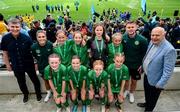 31 May 2023; Republic of Ireland manager Stephen Kenny, Republic of Ireland's Jamie Finn, Conor Levingston of Wexford FC and FAI President Gerry McAnaney with Gaelscoil Mhic Amhlaigh, Galway, after the ‘C’ Girls Cup, for large sized schools, at the FAI Primary School 5s National Finals in the Aviva Stadium, Dublin. Photo by Stephen McCarthy/Sportsfile