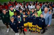 31 May 2023; Republic of Ireland's Jamie Finn and FAI President Gerry McAnaney with Scoil Cholmcille, Letterkenny, Donegal, after the ‘C’ Cup, for mixed large sized schools, at the FAI Primary School 5s National Finals in the Aviva Stadium, Dublin. Photo by Stephen McCarthy/Sportsfile