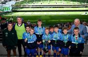 31 May 2023; Republic of Ireland's Jamie Finn and FAI President Gerry McAnaney with St Joseph’s NS, Hacketstown, Carlow, players who won the ‘A’ Cup, for mixed small sized schools, at the FAI Primary School 5s National Finals in the Aviva Stadium, Dublin. Photo by Stephen McCarthy/Sportsfile