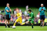 31 May 2023; Eoin Hirrell of Scoil Íosagáin, Buncrana, Donegal, left, in action against Cian Higgins of St Columba’s NS, Ballybrack, Cork, during the Special Schools Cup at the FAI Primary School 5s National Finals in the Aviva Stadium, Dublin. Photo by Stephen McCarthy/Sportsfile