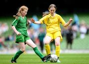 31 May 2023; Erin Logue of Scoil Colmcille, Kerrykeel, Donegal, right, in action against Lillian Fleming of Castleblakeney NS, Galway, during the ‘A’ Girls Cup, for small sized schools, at the FAI Primary School 5s National Finals in the Aviva Stadium, Dublin. Photo by Stephen McCarthy/Sportsfile