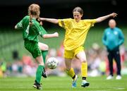 31 May 2023; Erin Logue of Scoil Colmcille, Kerrykeel, Donegal, right, in action against Lillian Fleming of Castleblakeney NS, Galway, during the ‘A’ Girls Cup, for small sized schools, at the FAI Primary School 5s National Finals in the Aviva Stadium, Dublin. Photo by Stephen McCarthy/Sportsfile