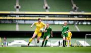 31 May 2023; Aine Doherty of Scoil Colmcille, Kerrykeel, Donegal, left, in action against Ciara McGinty of Castleblakeney NS, Galway, during the ‘A’ Girls Cup, for small sized schools, at the FAI Primary School 5s National Finals in the Aviva Stadium, Dublin. Photo by Stephen McCarthy/Sportsfile