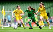 31 May 2023; Mairéad Mullins of Castleblakeney NS, Galway, in action against Cliodhna Robinson, left, and Aishling Duffy of Scoil Colmcille, Kerrykeel, Donegal, during the ‘A’ Girls Cup, for small sized schools, at the FAI Primary School 5s National Finals in the Aviva Stadium, Dublin. Photo by Stephen McCarthy/Sportsfile