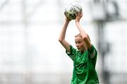 31 May 2023; Neasa Ní Gháirbhit of Gaelscoil Mhic Amhlaigh, Galway, takes a throw in during the ‘C’ Girls Cup, for large sized schools, at the FAI Primary School 5s National Finals in the Aviva Stadium, Dublin. Photo by Stephen McCarthy/Sportsfile