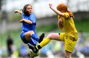 31 May 2023; Lucy Kinsella of Scoil Naomh Peadar S’Pol, Ballon, Carlow, in action against Tara McDaid of St Patrick’s NS, Lurgybrack, Donegal, right, during the ‘B’ Girls Cup, for medium sized schools, at the FAI Primary School 5s National Finals in the Aviva Stadium, Dublin. Photo by Stephen McCarthy/Sportsfile