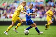 31 May 2023; Isla Larkin of St Patrick’s NS, Lurgybrack, Donegal, left, in action against Lucy Kinsella of Scoil Naomh Peadar S’Pol, Ballon, Carlow, during the ‘B’ Girls Cup, for medium sized schools, at the FAI Primary School 5s National Finals in the Aviva Stadium, Dublin. Photo by Stephen McCarthy/Sportsfile