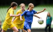 31 May 2023; Lucy Kinsella of Scoil Naomh Peadar S’Pol, Ballon, Carlow, in action against Isla Larkin and Cari Callaghan, left, of St Patrick’s NS, Lurgybrack, Donegal, during the ‘B’ Girls Cup, for medium sized schools, at the FAI Primary School 5s National Finals in the Aviva Stadium, Dublin. Photo by Stephen McCarthy/Sportsfile