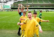 31 May 2023; Danny Bradley of Scoil Íosagáin, Buncrana, Donegal, celebrates with team-mates after the Special Schools Cup at the FAI Primary School 5s National Finals in the Aviva Stadium, Dublin. Photo by Stephen McCarthy/Sportsfile