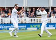1 June 2023; Stuart Broad of England, left, celebrates with his captain Ben Stokes after taking the wicket of Harry Tector of Ireland during day one of the Test Match between England and Ireland at Lords Cricket Ground in London, England. Photo by Matt Impey/Sportsfile