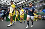 20 May 2023; Will Skelton of La Rochelle, left, and Andrew Porter of Leinster run onto the pitch before the Heineken Champions Cup Final match between Leinster and La Rochelle at Aviva Stadium in Dublin. Photo by Brendan Moran/Sportsfile