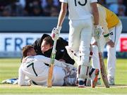 2 June 2023; James McCollum of Ireland twists his ankle after avoiding a ball bowled by Josh Tongue of England and has to leave the field injured during day two of the Test Match between England and Ireland at Lords Cricket Ground in London, England. Photo by Matt Impey/Sportsfile