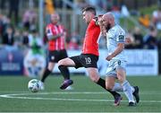 2 June 2023; Patrick McEleney of Derry City is tackled by Mark Coyle of Shelbourne during the SSE Airtricity Men's Premier Division match between Derry City and Shelbourne at The Ryan McBride Brandywell Stadium in Derry. Photo by Brendan Moran/Sportsfile