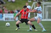 2 June 2023; Adam O'Reilly of Derry City holds off the challenge of Evan Caffrey of Shelbourne during the SSE Airtricity Men's Premier Division match between Derry City and Shelbourne at The Ryan McBride Brandywell Stadium in Derry. Photo by Brendan Moran/Sportsfile
