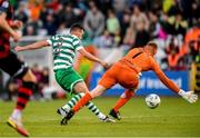 2 June 2023; Aaron Greene of Shamrock Rovers shoots to score his side's second goal past Dundalk goalkeeper Nathan Shepperd during the SSE Airtricity Men's Premier Division match between Shamrock Rovers and Dundalk at Tallaght Stadium in Dublin. Photo by Stephen McCarthy/Sportsfile