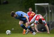 2 June 2023; Luke O'Regan of UCD in action against Mason Melia  of St Patrick's Athletic during the SSE Airtricity Men's Premier Division match between UCD and St Patrick's Athletic at UCD Bowl in Dublin. Photo by Harry Murphy/Sportsfile