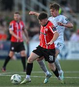 2 June 2023; Adam O'Reilly of Derry City in action against Evan Caffrey of Shelbourne during the SSE Airtricity Men's Premier Division match between Derry City and Shelbourne at The Ryan McBride Brandywell Stadium in Derry. Photo by Brendan Moran/Sportsfile
