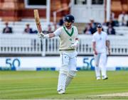 3 June 2023; Mark Adair of Ireland raises his bat to acknowledge the fans applause as he reaches 50 runs during day three of the Test Match between England and Ireland at Lords Cricket Ground in London, England. Photo by Matt Impey/Sportsfile