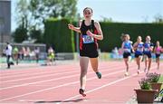 3 June 2023; Isabelle Cuffe of Lucan CC, Dublin, crosses the line to win the intermediate girls 3000m during the 123.ie All Ireland Schools' Track and Field Championships at Tullamore in Offaly. Photo by Sam Barnes/Sportsfile