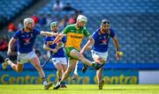 3 June 2023; Ronan McDermott of Donegal kicks a point despite the attention of Sam O Dowd, left, and Andrew Kavanagh of Wicklow during the Nickey Rackard Cup Final match between Donegal and Wicklow at Croke Park in Dublin. Photo by Harry Murphy/Sportsfile