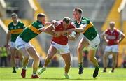 3 June 2023; Brian Hurley of Cork is tackled by Jason Foley, left, and Jack Barry of Kerry during the GAA Football All-Ireland Senior Championship Round 2 match between Cork and Kerry at Páirc Ui Chaoimh in Cork. Photo by Eóin Noonan/Sportsfile