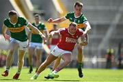 3 June 2023; Brian Hurley of Cork is tackled by Jason Foley, left, and Jack Barry of Kerry during the GAA Football All-Ireland Senior Championship Round 2 match between Cork and Kerry at Páirc Ui Chaoimh in Cork. Photo by Eóin Noonan/Sportsfile