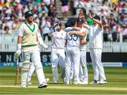 3 June 2023; England players celebrate the wicket of Mark Adair of Ireland during day three of the Test Match between England and Ireland at Lords Cricket Ground in London, England. Photo by Matt Impey/Sportsfile