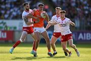 3 June 2023; Stefan Campbell of Armagh is tackled by Tyrone players, from left, Ronan McNamee, Michael O’Neill and Conor Meyler during the GAA Football All-Ireland Senior Championship Round 2 match between Tyrone and Armagh at O'Neill's Healy Park in Omagh, Tyrone. Photo by Brendan Moran/Sportsfile